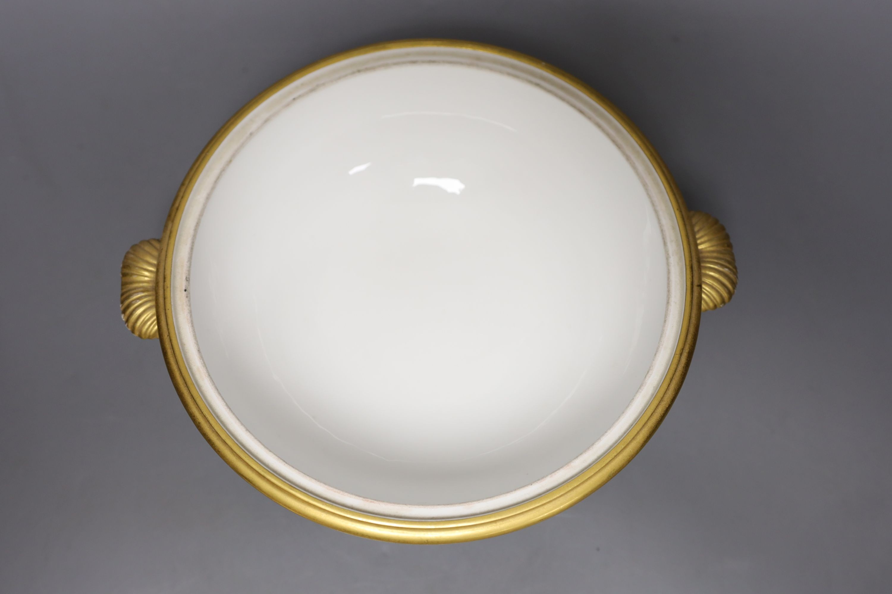 A Sevres ecuelle and cover, painted with a band of flowers surrounding the gilt monogram of Louis Phillipe, blue mark dated 1850, red mark for Chateau de Compiegne 25cm